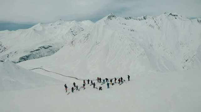 Freeride snowboarding in winter. Heliboarding freeride. Riding in powder on snowborad. Ski, Snowboard freeride i deep powder snow. Gudauri Georgia Caucasus resort. Freeride in Caucasus mountains. 