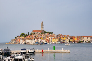 Panoramic view of Rovinj, a town on the Adriatic coast on the Istrian peninsula, Croatia. The harbor with ships and boats in the foreground