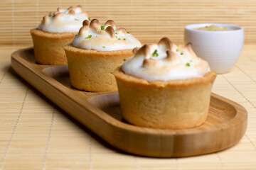 Baked tartlets with white cream and lemon, delicious dessert