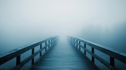 Fototapeta premium A foggy bridge stretching into the distance, disappearing into the mist, symbolizing mystery and exploration