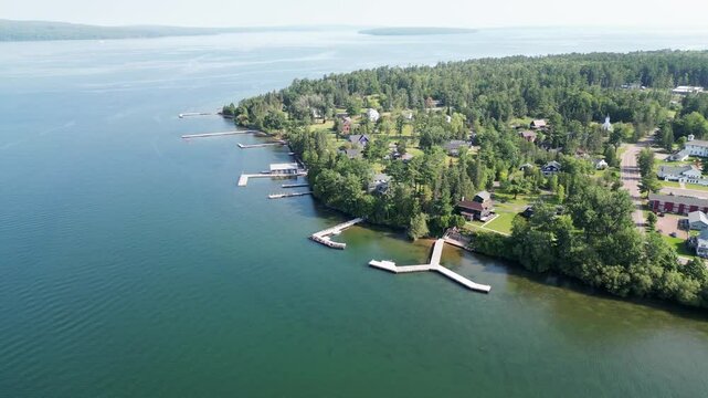 Beautiful Location Shot Over The Charming Town Of La Pointe, Ashland County, Wisconsin, USA. 4K Aerial Reverse Ascend Over The Main Ferry Port Of Madeline Island, Lake Superior.