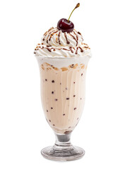 Milkshake Tall glass with ice cream milk and flavorings topped with whipped cream and cherry