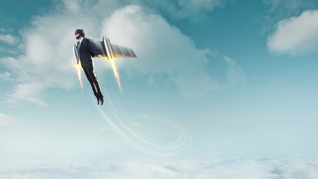 Businessman flying with jetpack above clouds reaching success