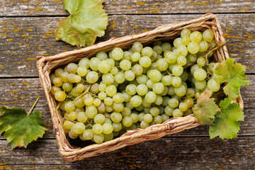 A wicker basket brimming with grapes