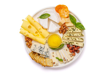 An assortment of various cheeses arranged on a plate, highlighting different textures
