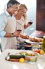 Married couple, food and wine with cooking, love or laugh for bonding together in kitchen. Mature...