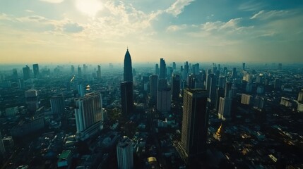 Fototapeta premium The skyline of Bangkok captured in an aerial shot, with skyscrapers standing tall over the