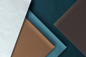 Fototapeta premium Elegance meets innovation in this 3D background, where material textures and geometric shapes come together in a palette of blue, white, and brown