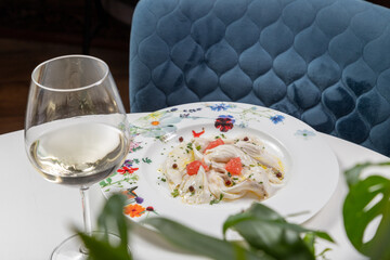 Sea bass carpaccio with pink pepper