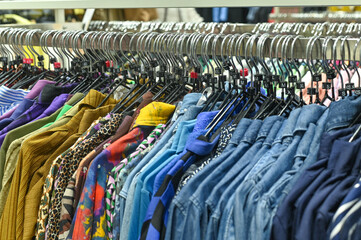 Fototapeta premium clothes in the store on hangers. concept