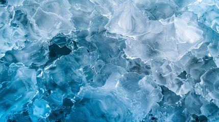 Obraz premium A stunning abstract close-up of ice formations in shades of blue, capturing the intricate textures and patterns of frozen water, conveying a sense of coolness and serenity.