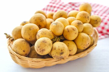 Bunch of Longkong  in basket on white background	