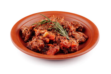 Delicious beef stew with vegetables simmering on plate