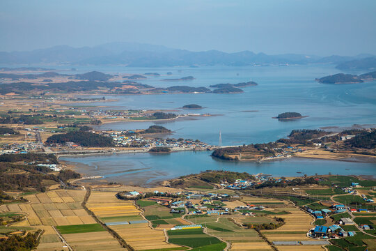 Aerial view of farming village and Wando Island in autumn seen from Dalmasan Mountain near Haenam-gun, Jeollanam-do, South Korea