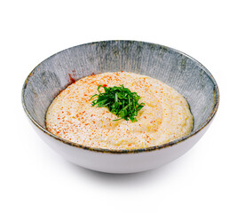 Creamy polenta topped with red pepper flakes and fresh parsley