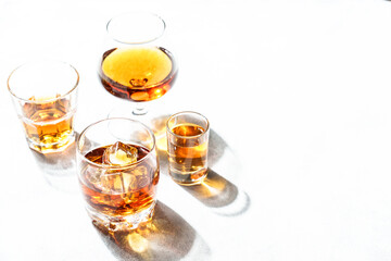 Strong alcohol drink. Cognac, whisky, rum, tequila at white background.