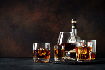 Strong alcohol drink. Whisky, rum, tequila, cognac at dark bar.