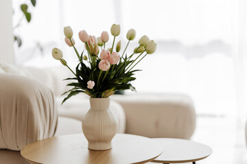 Bouquet of white and pink tulips bringing freshness to scandinavian interior design