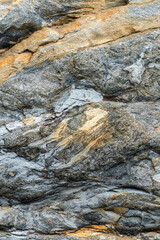 Old gray stone background with dark cracks, great for your design and texture background. Vertical image.