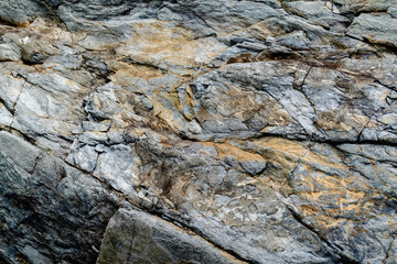 Old gray stone background with dark cracks, great for your design and texture background. Horizontaal image.