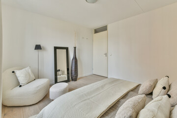 Modern minimalist bedroom with neutral tones and decor