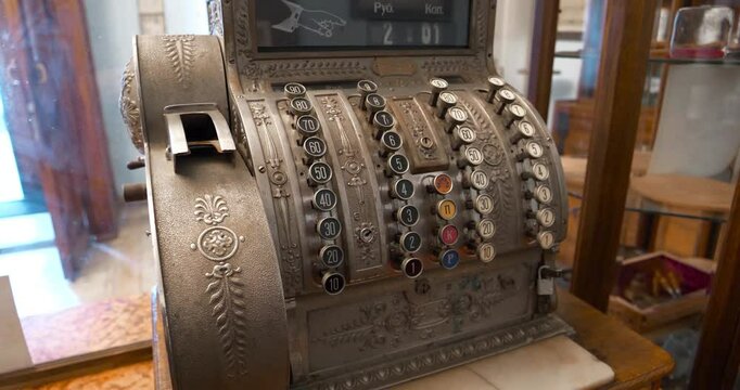 Old mechanical cash register in an old pharmacy. Antique cash register