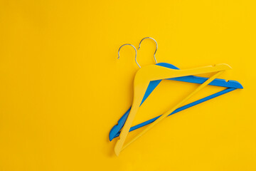Wooden clothes hanger on isolated background.