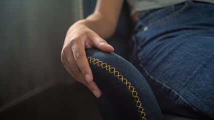 Close up of hand of African American girl sitting on chair and gesturing during consultation with...