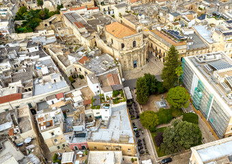 Fototapeta premium Aerial view of the church of Santa Chiara which is located in the historic center of Lecce, in Puglia, Italy. It was built in Baroque architectural style.