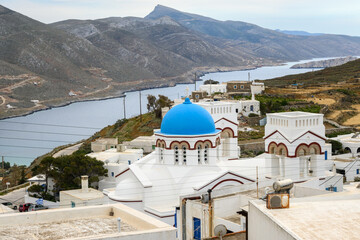 Traditional Greek Orthodox church in Tholaria. Aegiali Bay in background. Amorgos island in...