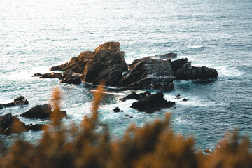 Precise rocks on the sea coast during sunset
