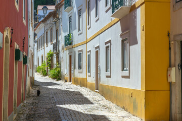 Narrow empty street in the old town Tomar in Portugal.