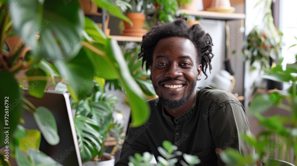 Aufkleber a man with a beard and dreadlocks is smiling in front of a plant
