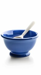 A blue bowl with a spoon in it
