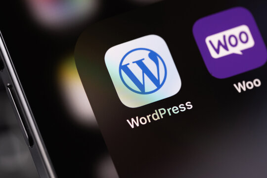 WordPress and WooCommerce mobile app on a screen smartphone iPhone. WordPress - open source site content management system. Batumi, Georgia - August 5, 2024