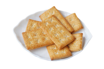 Biscuits  crackers on white plate, isolated in white background. Concept, bake bakery. Snack sweet food with high calorie and carbohydrate but delicious to eat with coffee or other beverages.  