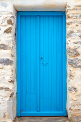 Blue door of a traditional Greek house in Tholaria on Amorgos island. Cyclades, Greece