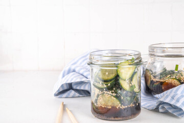 Trendy viral Asian cucumber salad, soy sauce marinated pickled cucumber salad with sesame oil and spices