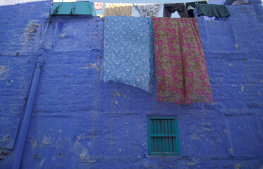 a blue painted living House in the Blue City and Town of Jodhpur in the Province of Rajasthan in India.  India, Jodhpur, January, 1998