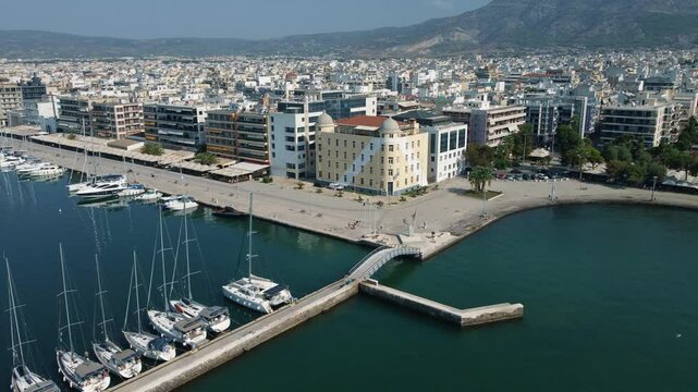 Aerial shot 4k of harbor and university of Volos, Greece 
