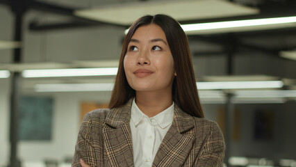 Fototapeta premium Asian girl in office Korean business woman lady Chinese businesswoman Japanese female manager worker student indoors confused pensive think thoughtful thinking puzzled solving challenge idea solution
