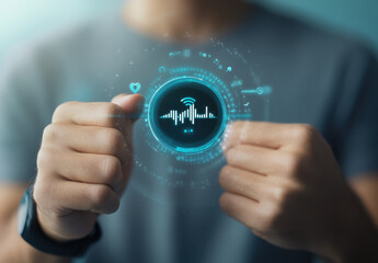 A man is holding his smartwatch on his left hand, and he has a voice AI icon floating above it with an audio wave diagram in white. The background of the male's hands wearing a gray t-shirt is blurred
