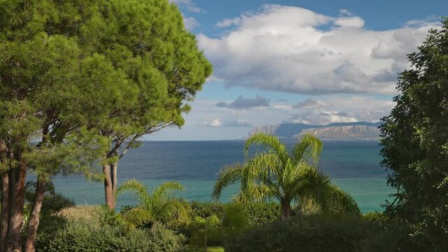 Landscape with green trees, sea and mountains of western Sicily, near Palermo, Italy. Nature of Sicily