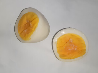 Egg slices on white background. Hen boiled cut egg with white background 