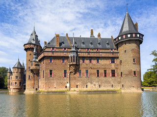 De Haar Castle exterior, Utrecht, Netherlands. The famous and biggest medieval castle in the Netherlands, tourist landmark, view from lake at sunny summer day