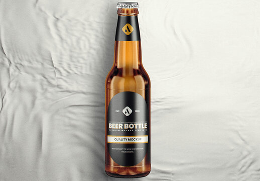 Amber Beer Bottle On Fabric Mockup