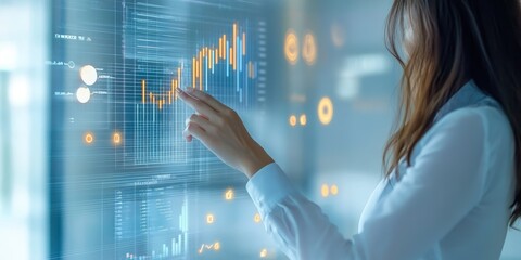 Business professional analyzing market trends on a digital screen with financial graphs.