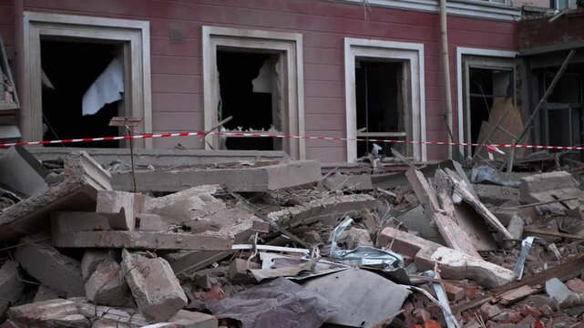 A vivid depiction of destruction, captures a pile of debris and the facade of a building with broken windows. The scene conveys the harsh reality of the decline of cities or the consequences of a disa