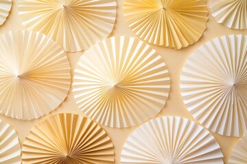Golden and Ivory Folding Fans on Soft Beige Background