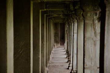 Exploring the serene corridors of Angkor Wat in Cambodia during a peaceful early morning